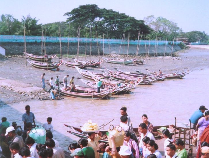 Disembarking from ferry at Dalah on Yangon River in Yangon ( Rangoon ) in Myanmar ( Burma )