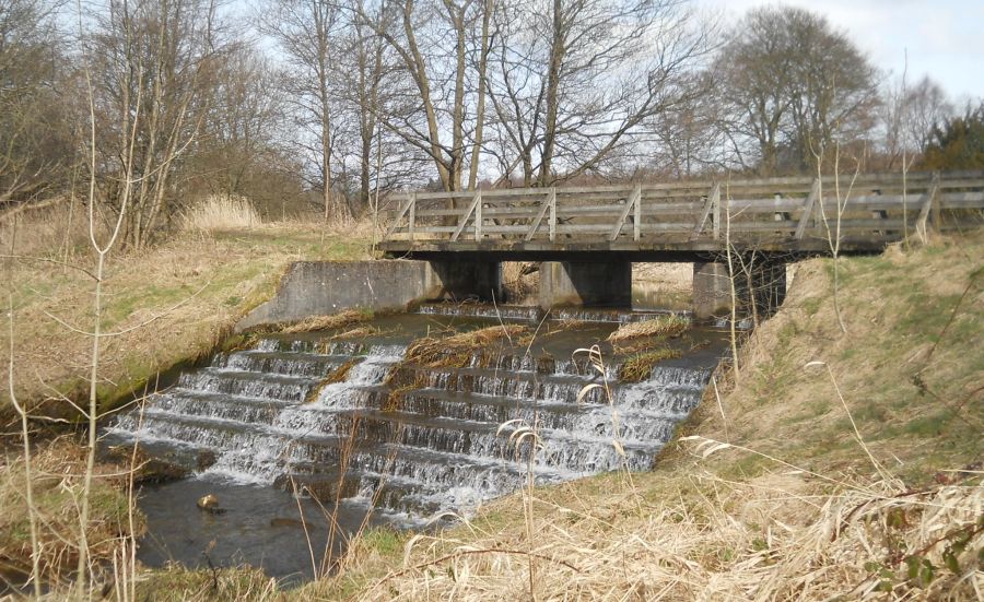 Waterfalls beneath footbridge in Dougalston Estate